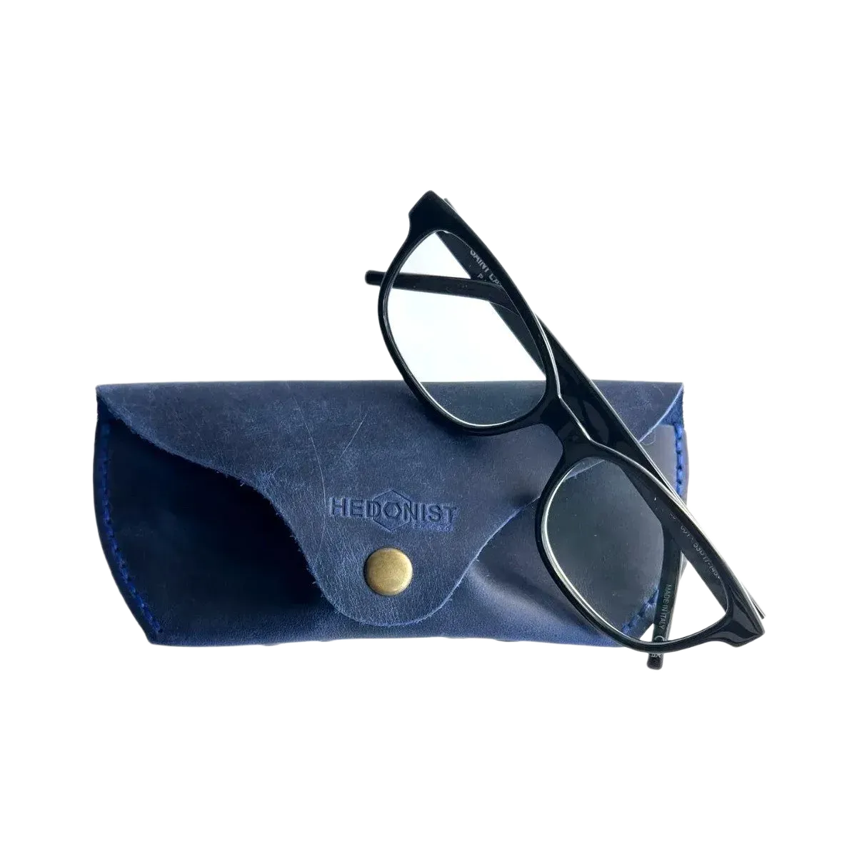 Soft Leather Eye Glasses Case in Navy Blue with black-framed eyeglasses resting on top