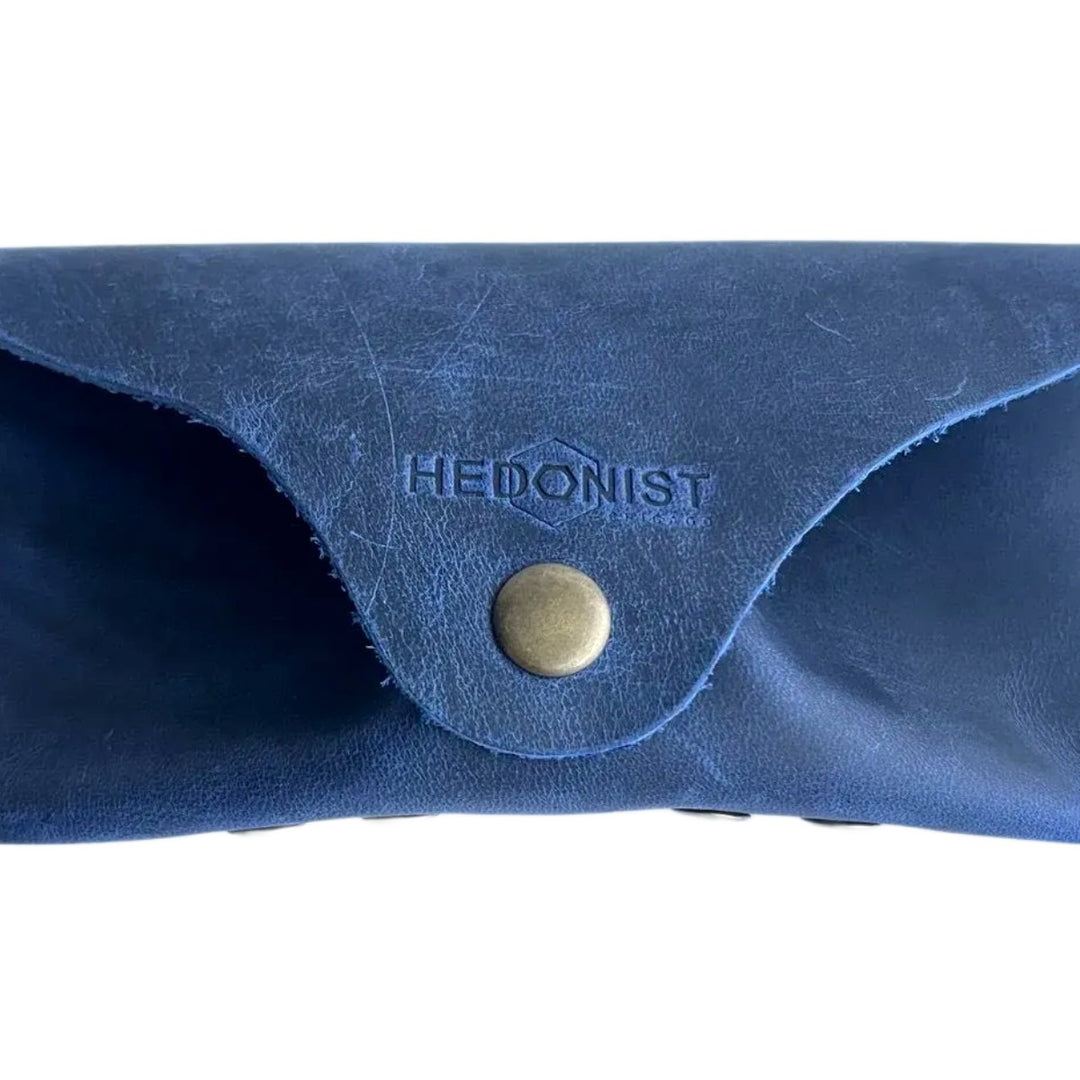 Soft Leather Eye Glasses Case in Navy Blue, closed, front view with embossed Hedonist logo and snap closure