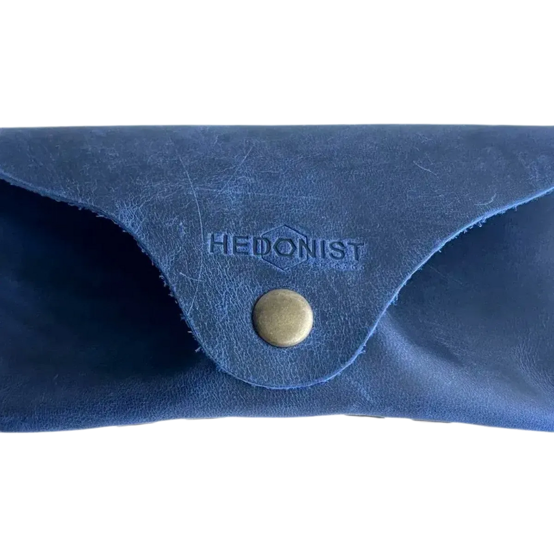Soft Leather Eye Glasses Case in Navy Blue, closed, front view with embossed Hedonist logo and snap closure