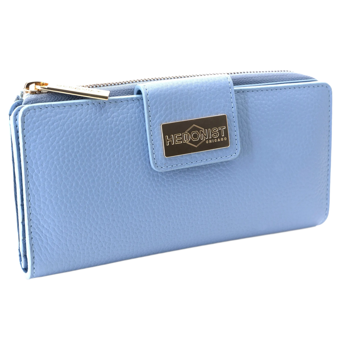 Blue pebbled leather travel wallet closed, front flap with gold-tone Hedonist Chicago plaque