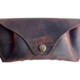 Soft Leather Eye Glasses Case in Brown, closed, front view with embossed Hedonist logo and snap closure