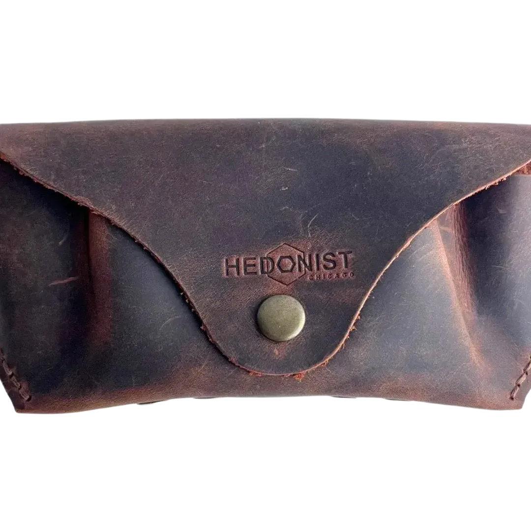 Soft Leather Eye Glasses Case in Brown, closed, front view with embossed Hedonist logo and snap closure