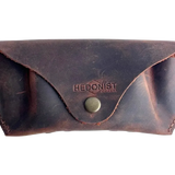 Soft Leather Eye Glasses Case in Brown, closed, front view with embossed Hedonist logo and snap closure