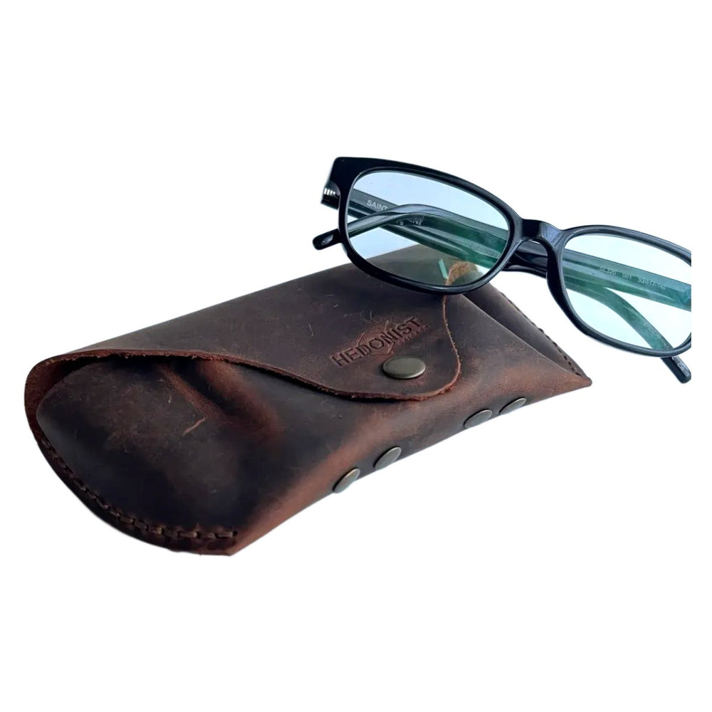 Soft Leather Eye Glasses Case in Brown with tinted-lens eyeglasses resting on top