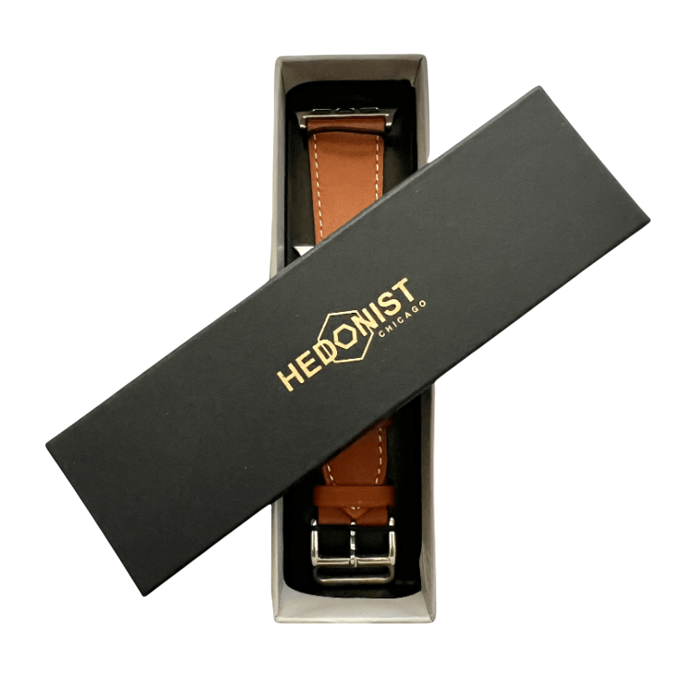 Brown leather Apple Watch band, presented in gift box