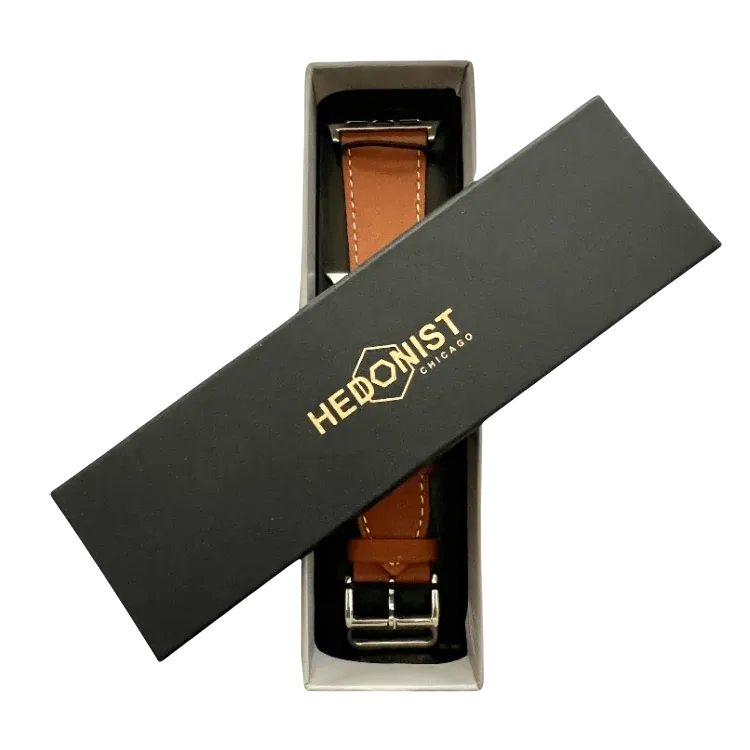 Brown leather Apple Watch band, presented in gift box