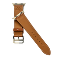 Brown leather Apple Watch band, texture and buckle detail close-up
