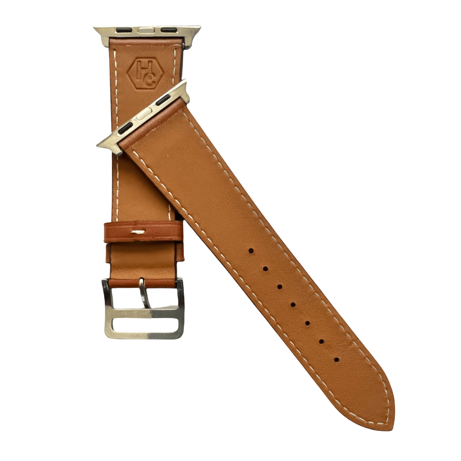 Brown leather Apple Watch band, texture and buckle detail close-up