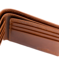 Close-up of a brown leather bifold wallet showing the interior card slots, stitching, and texture against a white background.