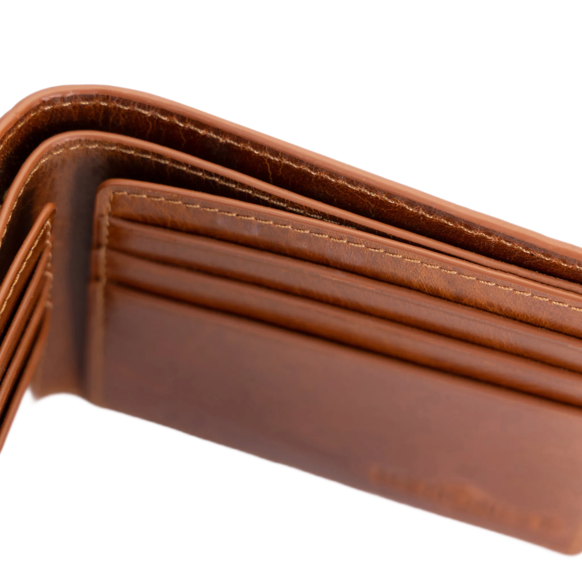 Close-up of a brown leather bifold wallet showing the interior card slots, stitching, and texture against a white background.