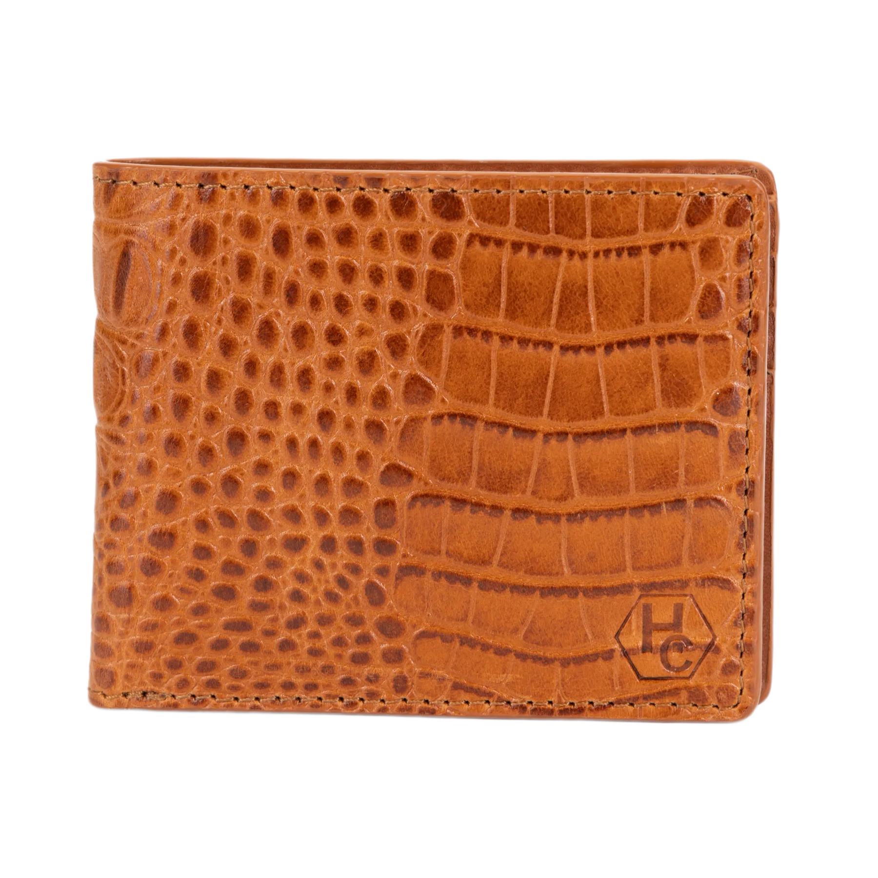 A brown bi-fold wallet with a crocodile-embossed texture, featuring a small embossed 'HC' logo in the bottom right corner, set against a plain white background.