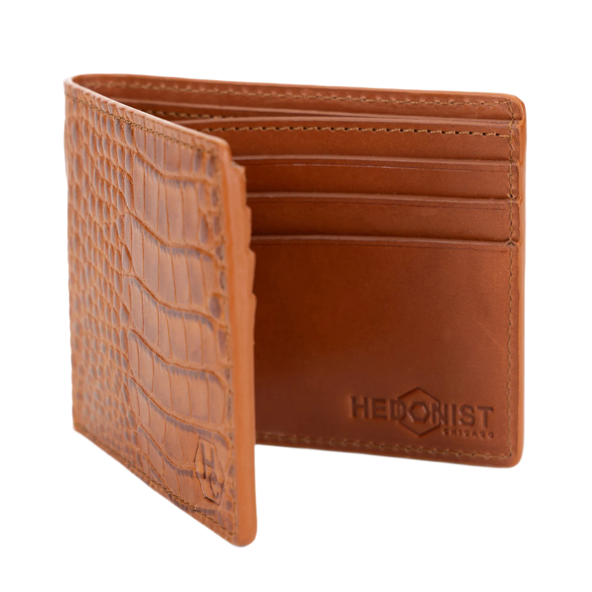 A brown croco leather bifold wallet shown open, displaying interior card slots and embossed brand name