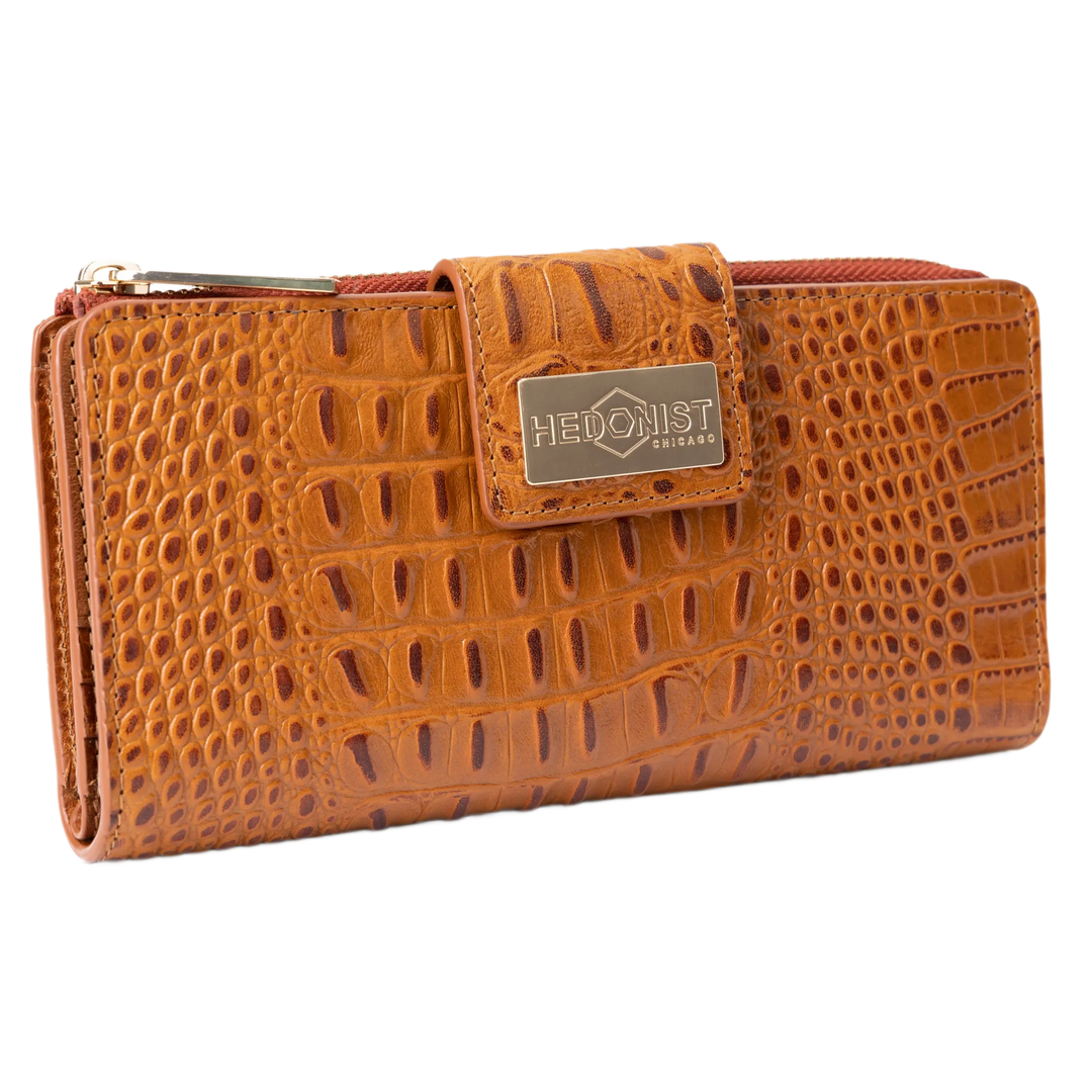 Brown croco-embossed leather travel wallet closed, front flap with gold-tone Hedonist Chicago plaque