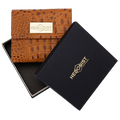 Small brown croco-embossed snap wallet for women, presented in branded box