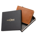 A brown leather bifold wallet displayed next to its black presentation box with gold 'HEDONIST CHICAGO' branding, on a clean white background.