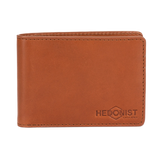 A brown leather bi-fold wallet with visible stitching and an embossed 'HEDONIST CHICAGO' logo in the bottom right corner, shown on a plain white background.