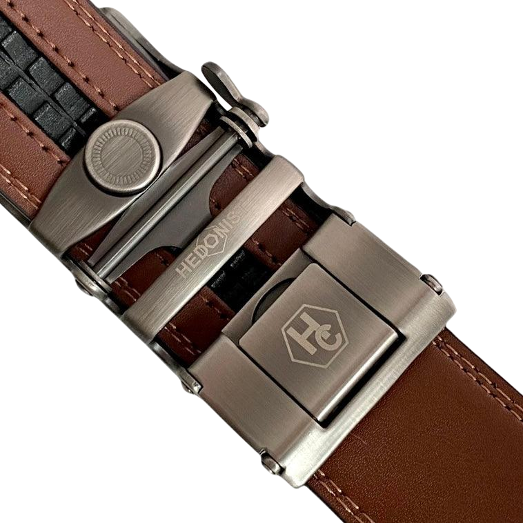 Brown leather dress ratchet belt with gunmetal frame buckle, hardware close-up