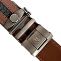 Brown leather dress ratchet belt with gunmetal frame buckle, hardware close-up