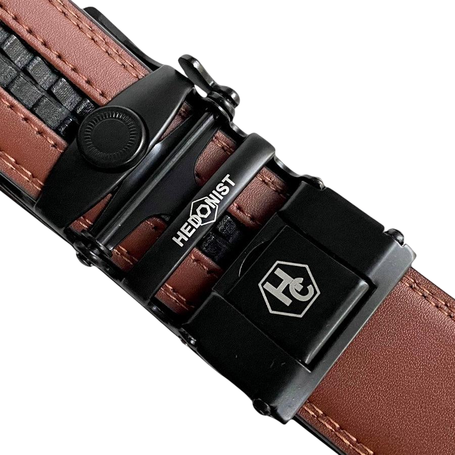 Brown leather ratchet belt with black plate buckle, hardware close-up