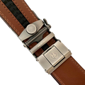 Brown leather ratchet belt with gunmetal buckle, hardware close-up