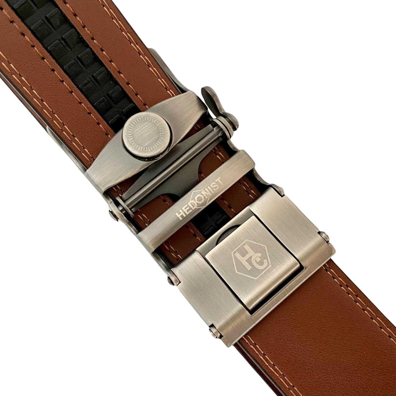 Brown leather ratchet belt with gunmetal buckle, hardware close-up
