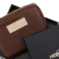 Small brown leather zip-around wallet for women, presented as a gift