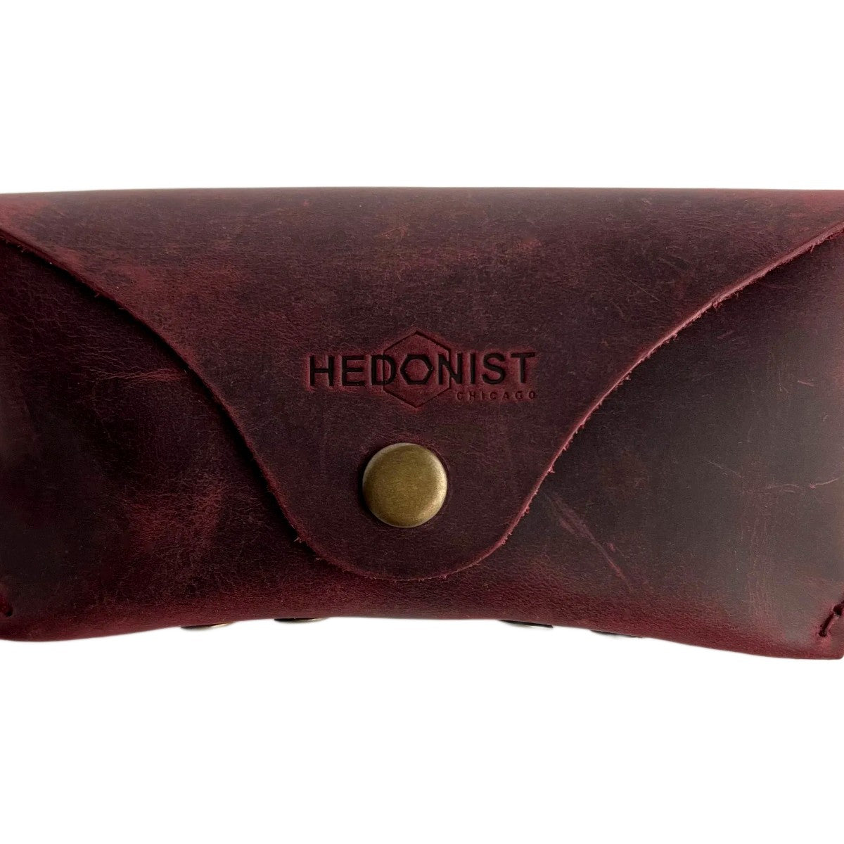 Soft Leather Eye Glasses Case in Burgundy, closed, front view with embossed Hedonist logo and snap closure
