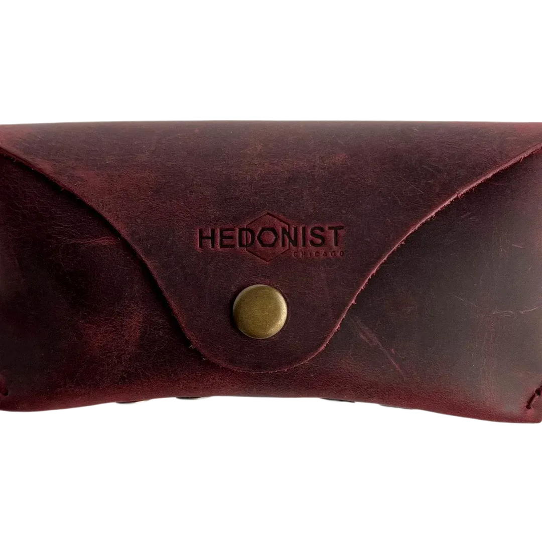Soft Leather Eye Glasses Case in Burgundy, closed, front view with embossed Hedonist logo and snap closure