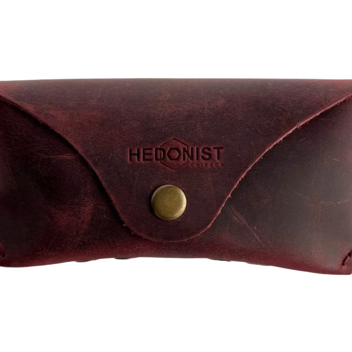 Soft Leather Eye Glasses Case in Burgundy, closed, front view with embossed Hedonist logo and snap closure