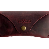 Soft Leather Eye Glasses Case in Burgundy, closed, front view with embossed Hedonist logo and snap closure
