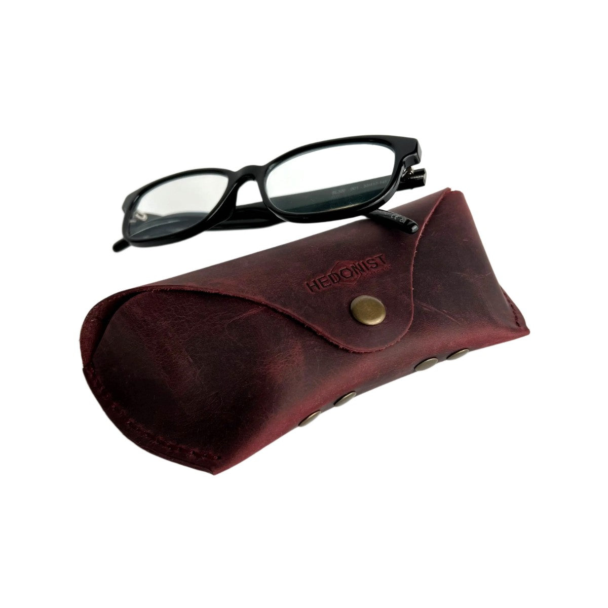 Soft Leather Eye Glasses Case in Burgundy with black-framed eyeglasses resting on top