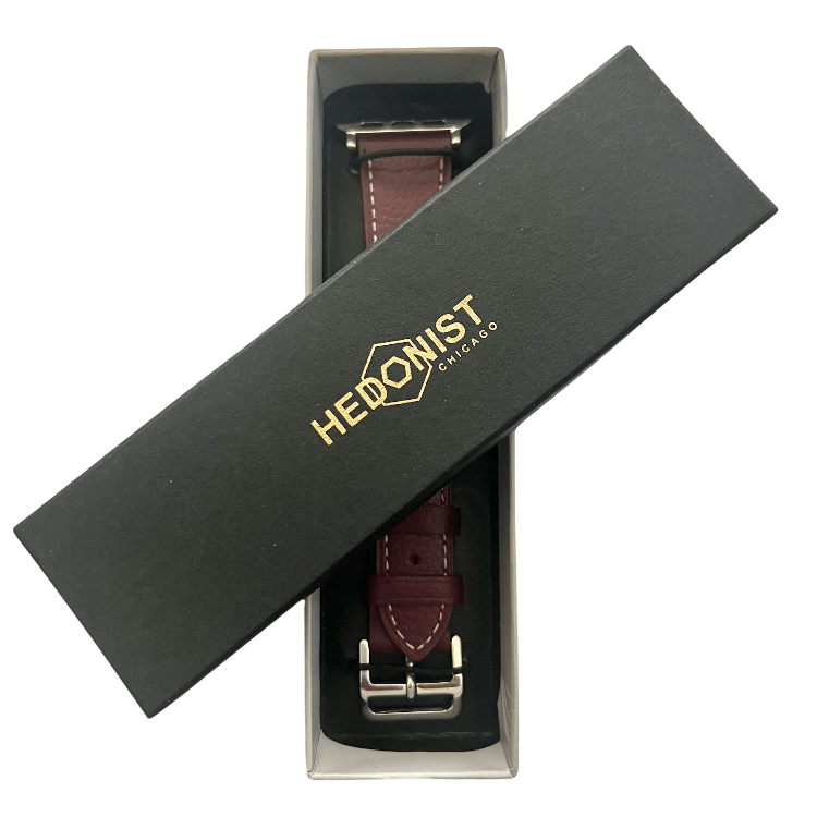 Burgundy leather Apple Watch band, presented in gift box