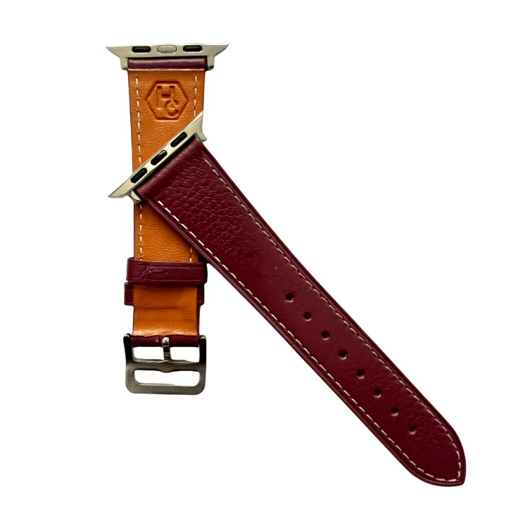 Burgundy leather Apple Watch band, texture and buckle detail close-up