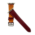 Burgundy leather Apple Watch band, texture and buckle detail close-up