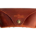 Soft Leather Eye Glasses Case in Cognac, closed, front view with embossed Hedonist logo and snap closure