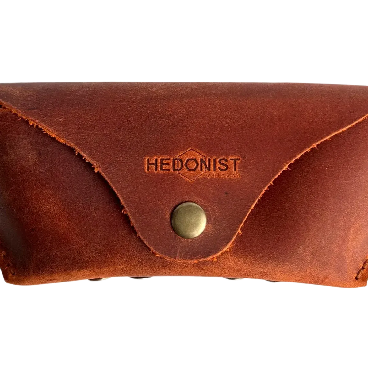 Soft Leather Eye Glasses Case in Cognac, closed, front view with embossed Hedonist logo and snap closure