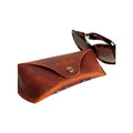 Soft Leather Eye Glasses Case in Cognac with tortoiseshell sunglasses beside it