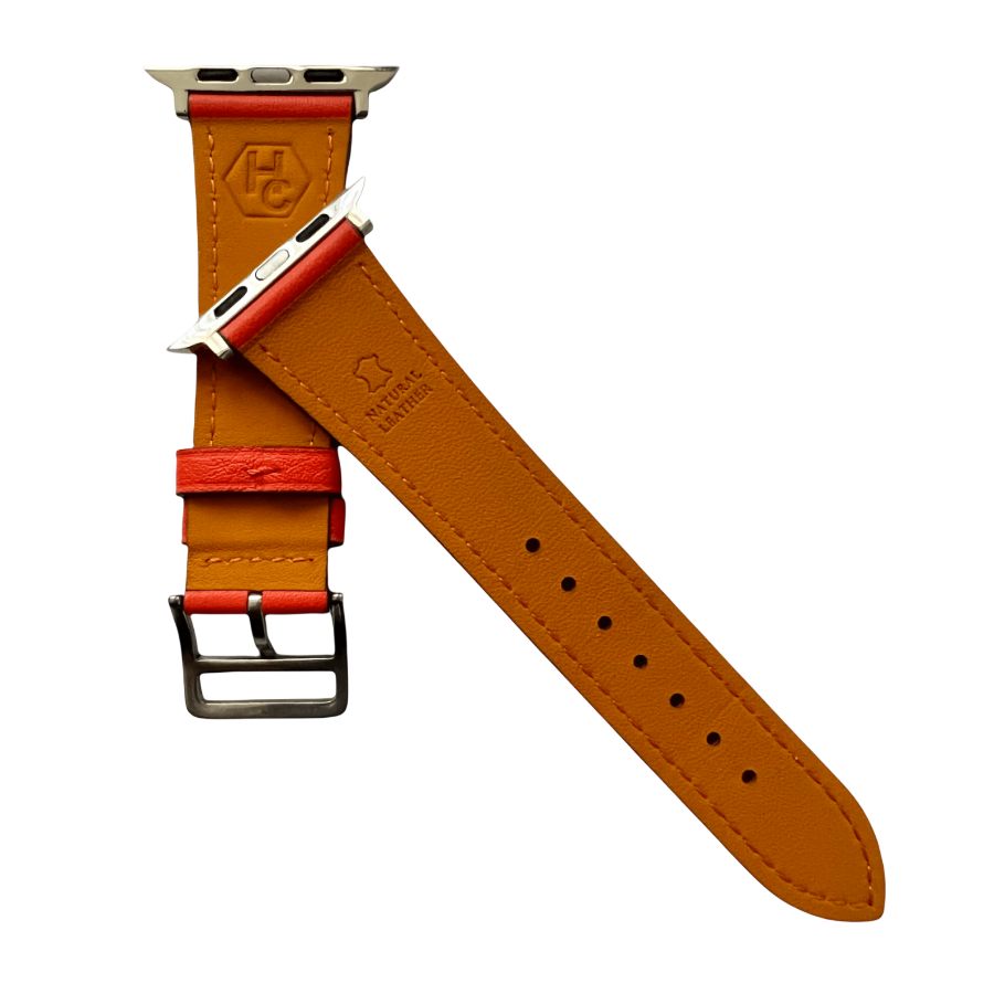 Cold orange leather Apple Watch band, texture and buckle detail close-up