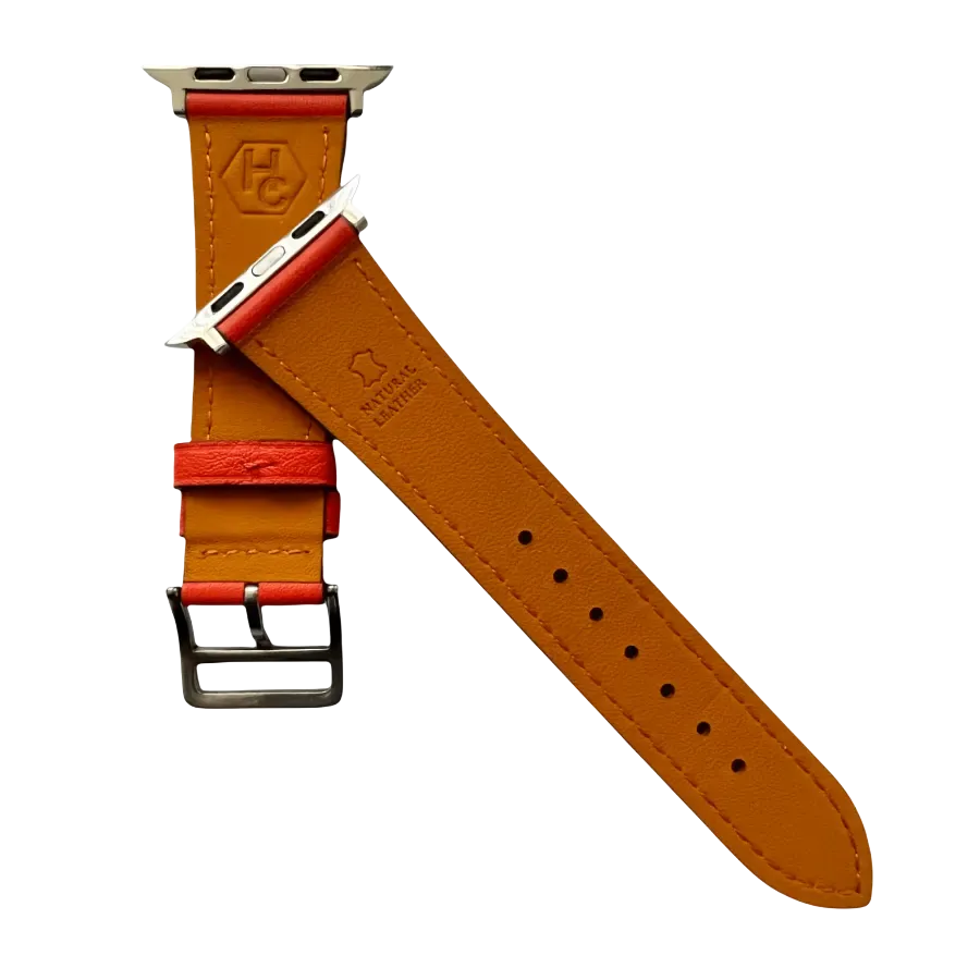 Cold orange leather Apple Watch band, texture and buckle detail close-up