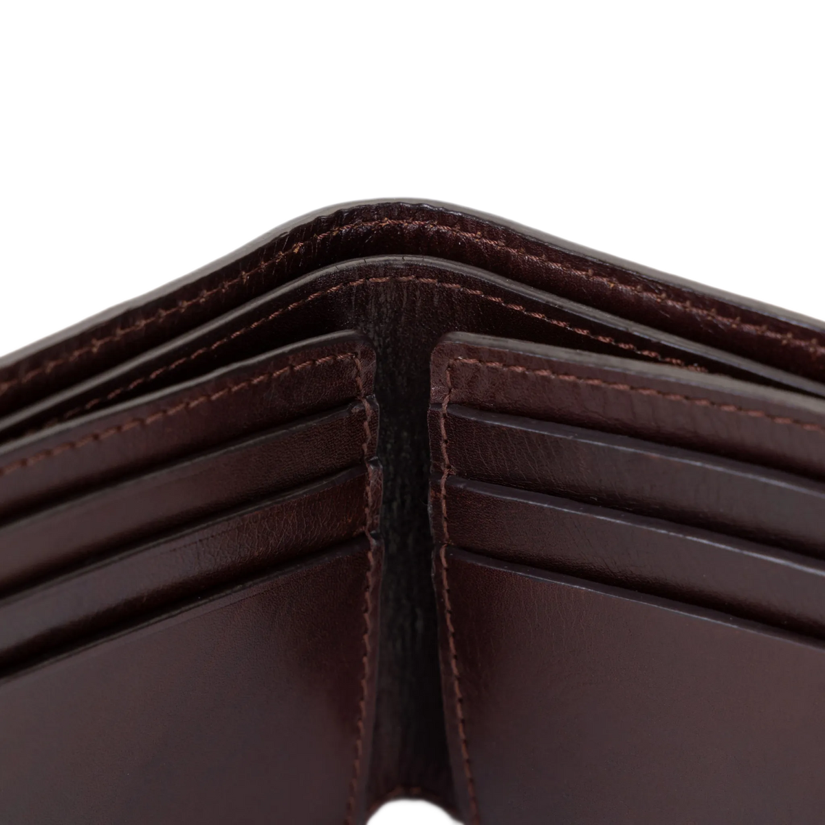 Close-up of dark brown leather bifold wallet center fold and stitching