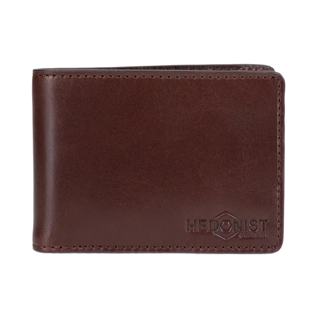 A dark brown leather bifold wallet with a debossed HEDONIST logo on the bottom right corner, shown against a plain white background.