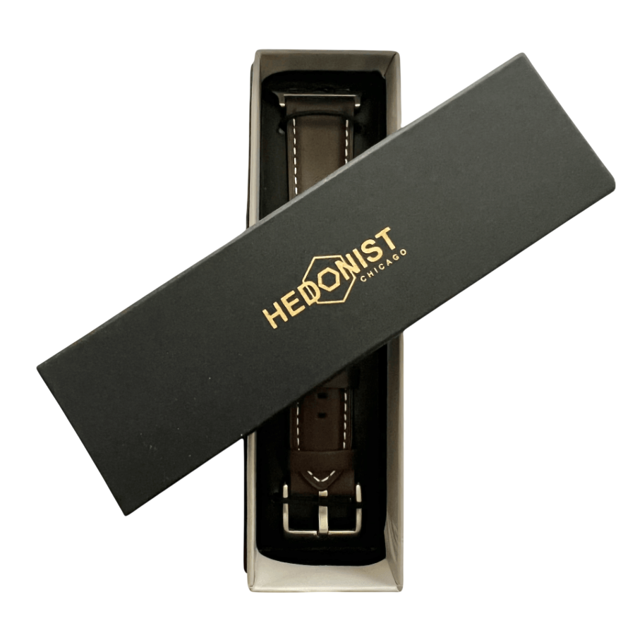 Dark brown padded leather Apple Watch band, packaging close-up