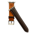 Dark brown padded leather Apple Watch band, texture and buckle detail close-up