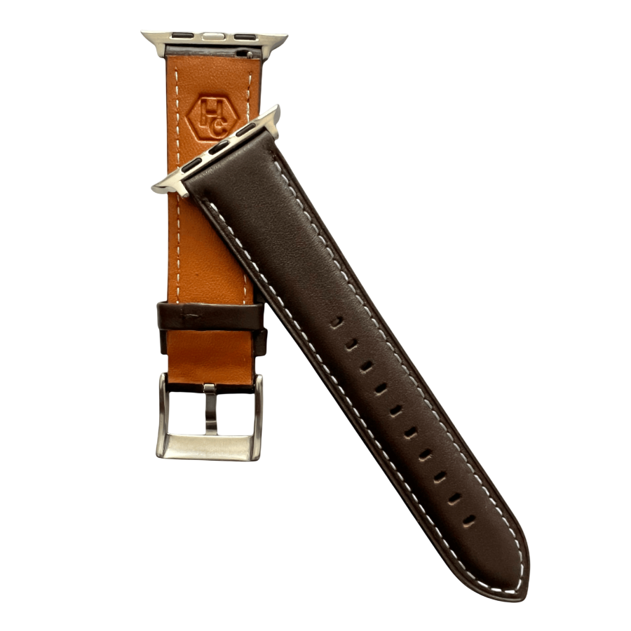 Dark brown padded leather Apple Watch band, texture and buckle detail close-up