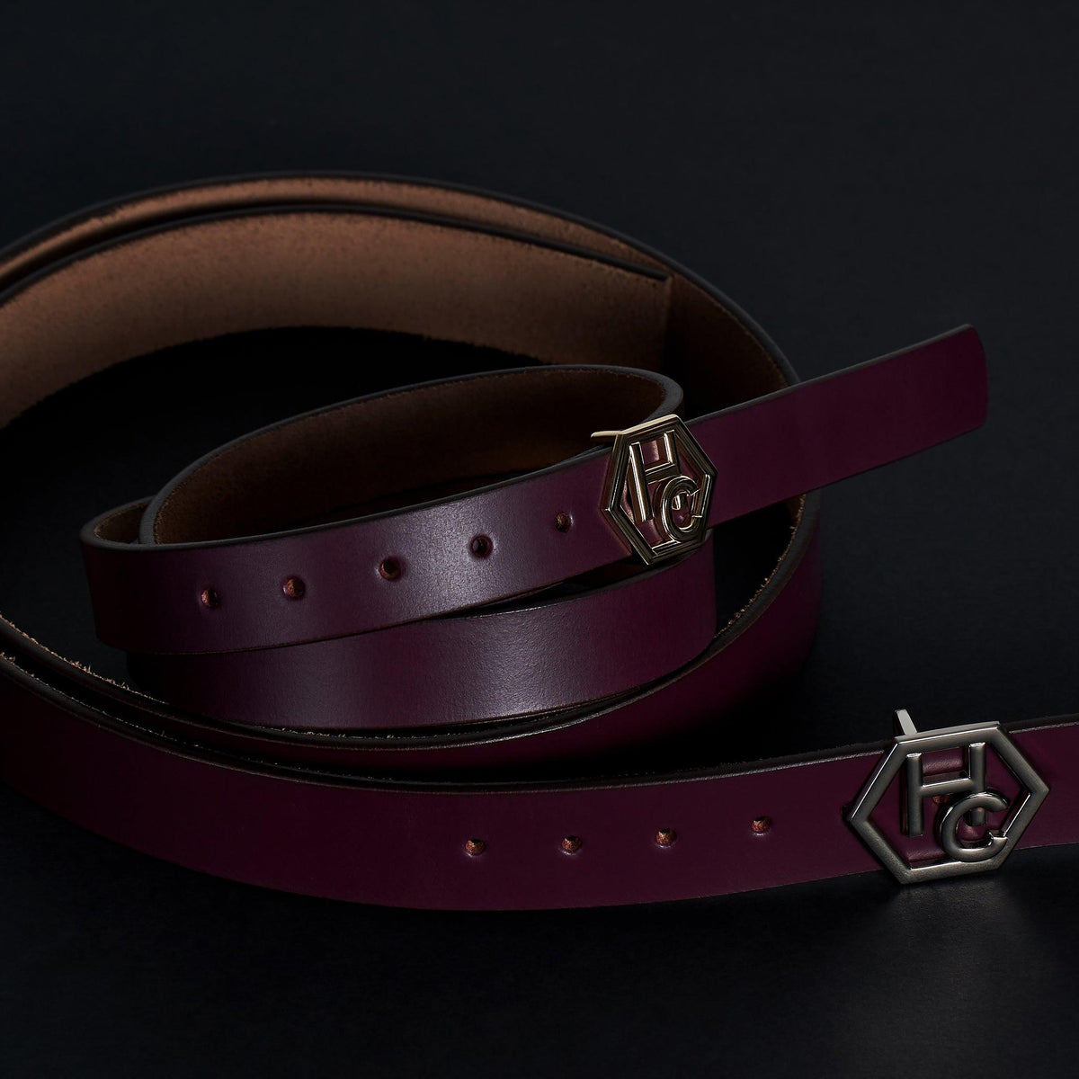 Edge stitching detail on women's seamless edge leather belt - dark purple - Hedonist Chicago - close-up view (1")