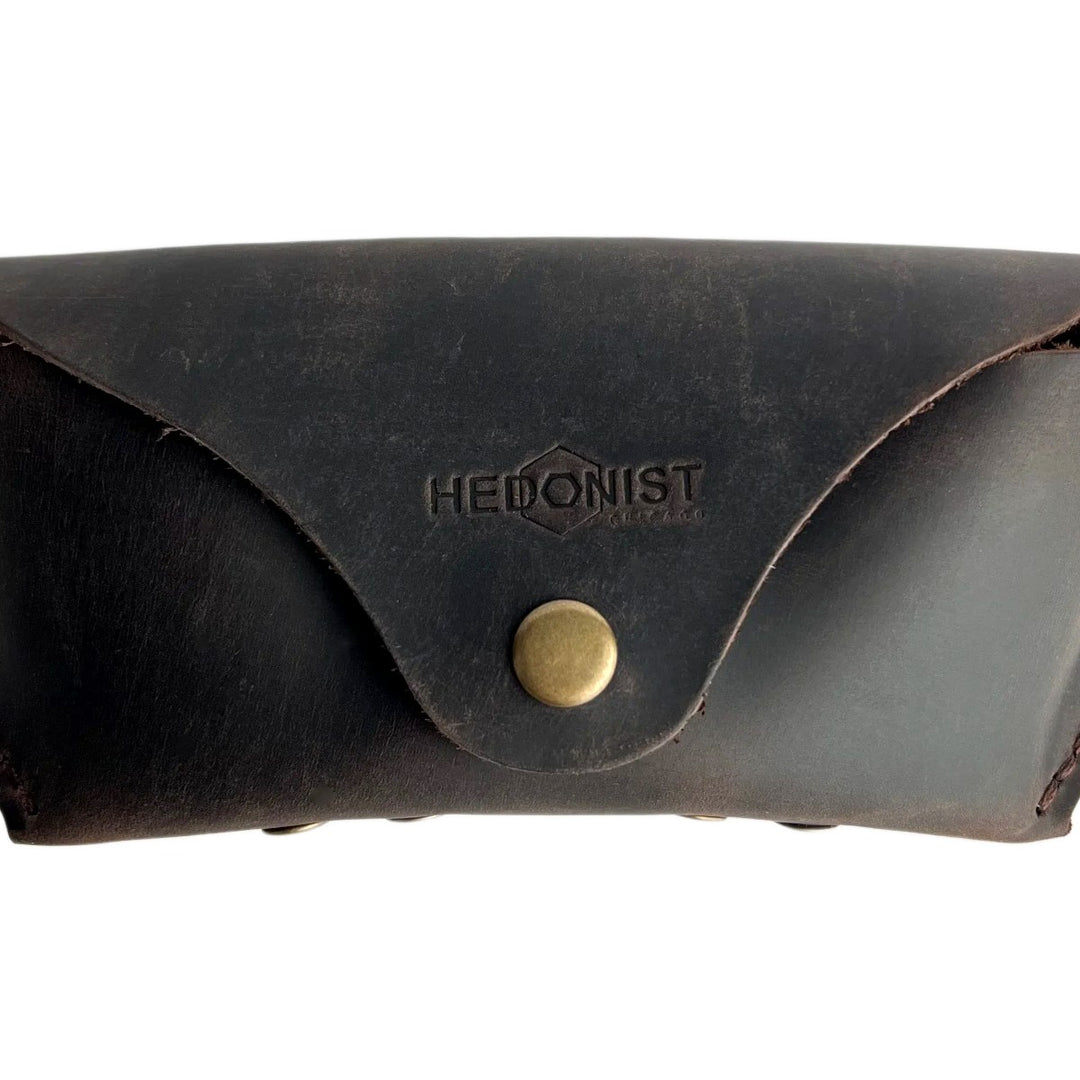 Soft Leather Eye Glasses Case in Dark Brown, closed, front view with embossed Hedonist logo and snap closure