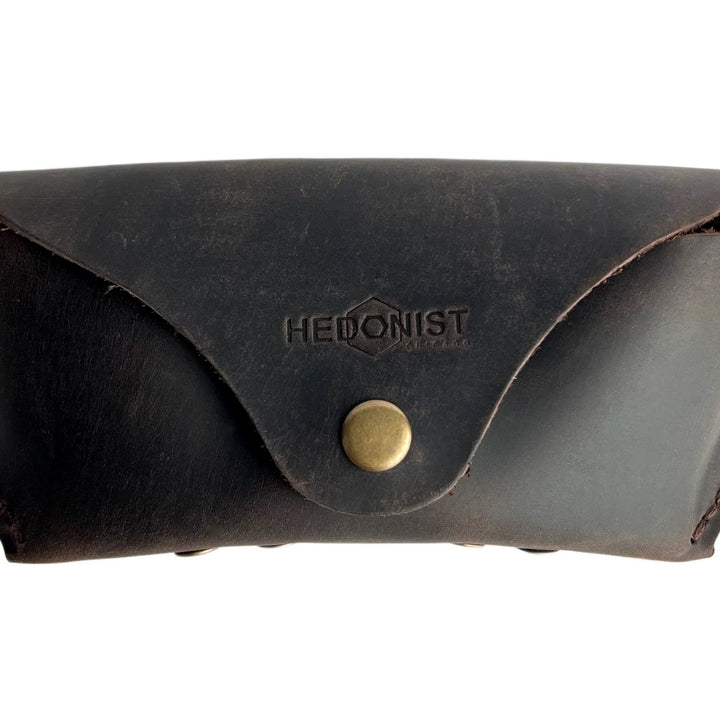 Soft Leather Eye Glasses Case in Dark Brown, closed, front view with embossed Hedonist logo and snap closure
