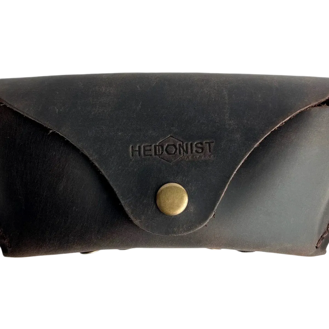 Soft Leather Eye Glasses Case in Dark Brown, closed, front view with embossed Hedonist logo and snap closure
