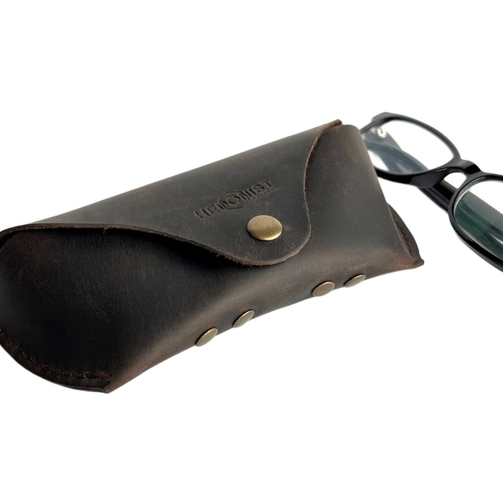 Soft Leather Eye Glasses Case in Dark Brown with black-framed eyeglasses beside it