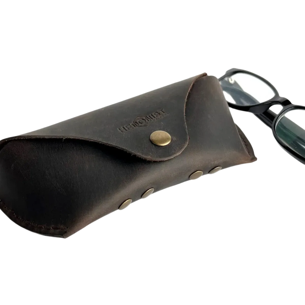 Soft Leather Eye Glasses Case in Dark Brown with black-framed eyeglasses beside it